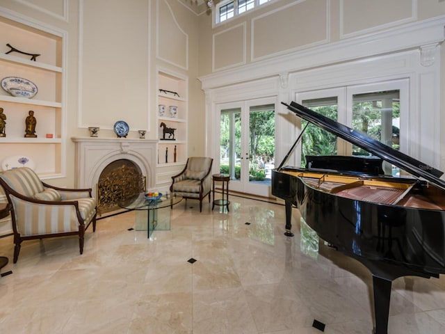 2901 Leprechaun Ln, Palm Harbor, FL 34683 - living area featuring a fireplace, french doors, and built in shelves