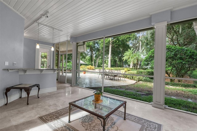 sunroom with wooden ceiling