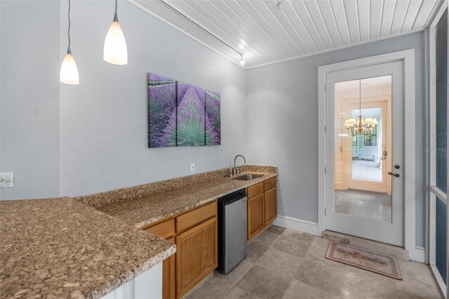2901 Leprechaun Ln, Palm Harbor, FL 34683 - interior space featuring wood ceiling, pendant lighting, brown cabinets, a sink, and a chandelier