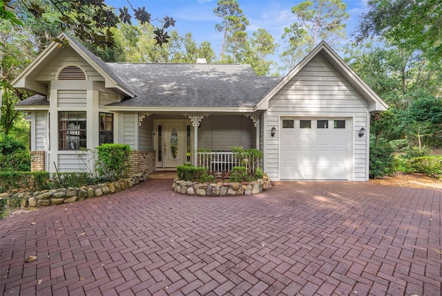2901 Leprechaun Ln, Palm Harbor, FL 34683 - ranch-style home featuring a porch, roof with shingles, a garage, decorative driveway, and brick siding