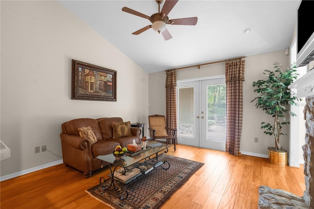 2901 Leprechaun Ln, Palm Harbor, FL 34683 - living room with a ceiling fan, baseboards, french doors, and light wood-type flooring