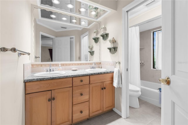 full bathroom featuring tile patterned flooring, vanity, toilet, and shower / tub combo with curtain