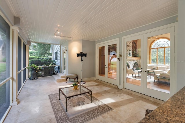 2901 Leprechaun Ln, Palm Harbor, FL 34683 - sunroom / solarium featuring rail lighting and french doors