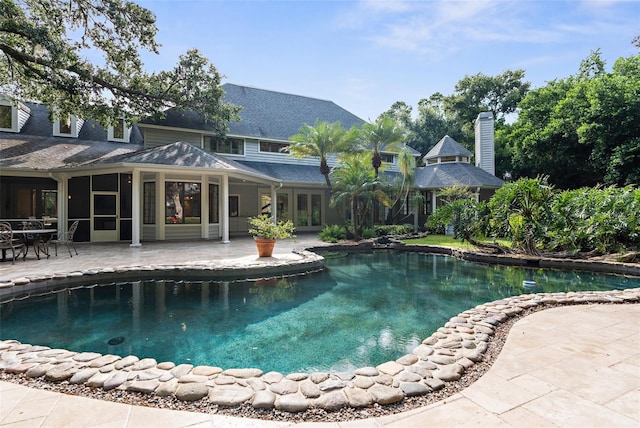 view of swimming pool featuring a patio