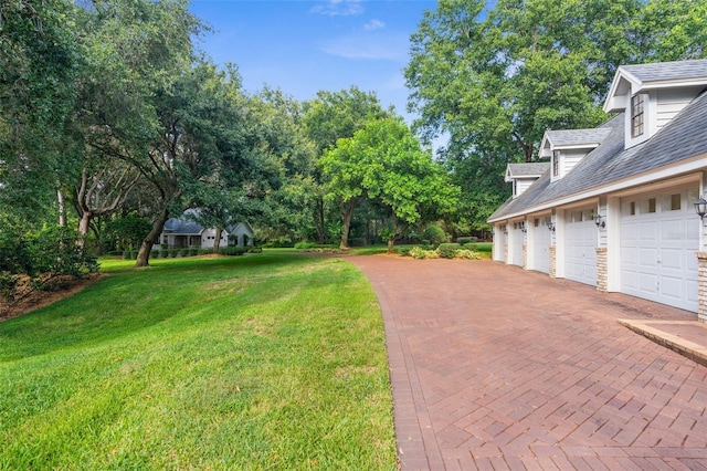 2901 Leprechaun Ln, Palm Harbor, FL 34683 - view of yard featuring decorative driveway and a garage