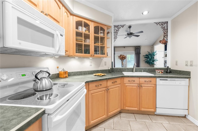 2901 Leprechaun Ln, Palm Harbor, FL 34683 - kitchen with dark countertops, white appliances, glass insert cabinets, ceiling fan, and a sink