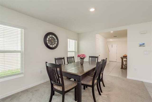 tiled dining area with plenty of natural light