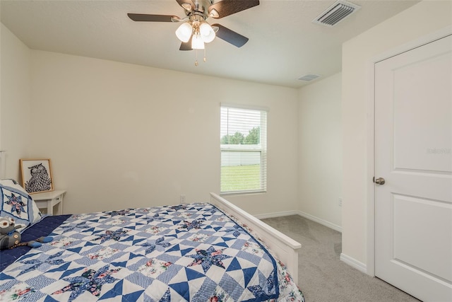 carpeted bedroom with ceiling fan