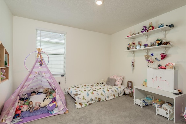 carpeted bedroom featuring a textured ceiling