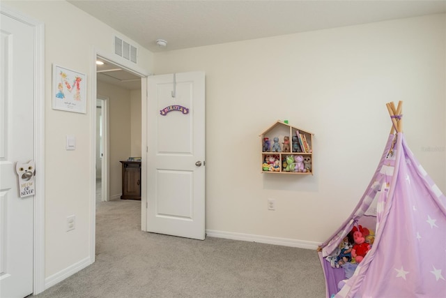 playroom featuring light colored carpet