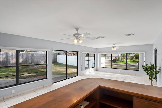 unfurnished sunroom featuring a wealth of natural light