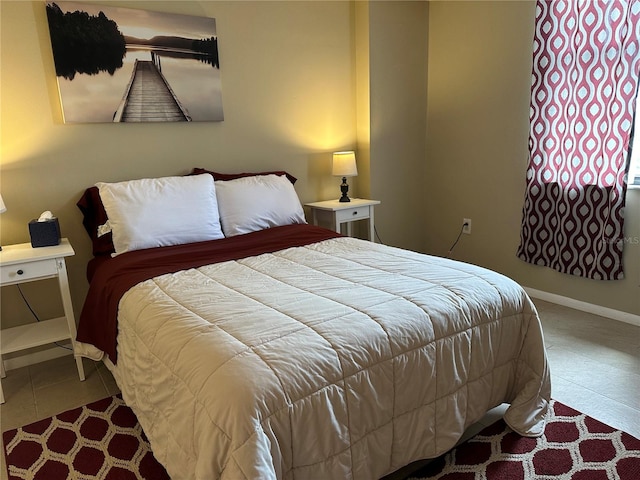 bedroom with tile patterned floors