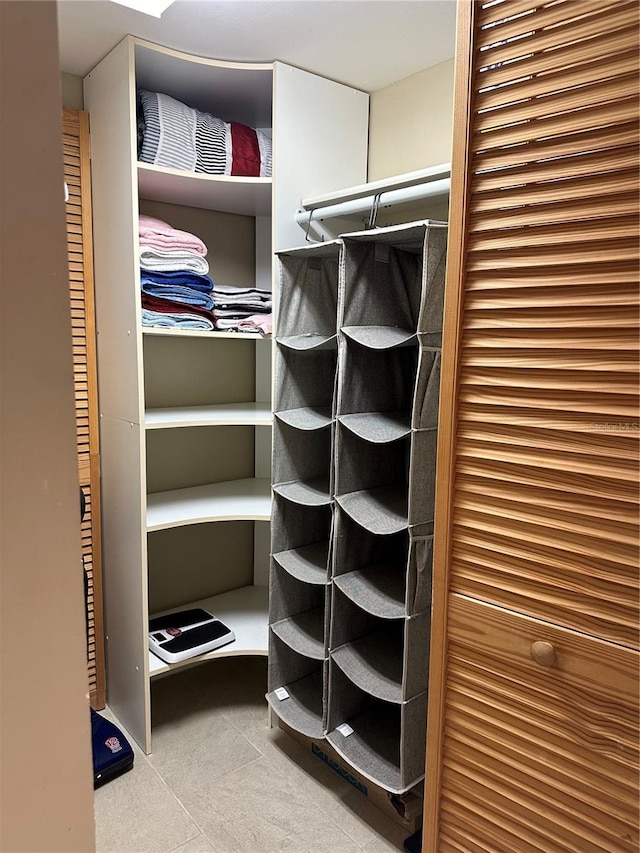 walk in closet featuring tile patterned flooring