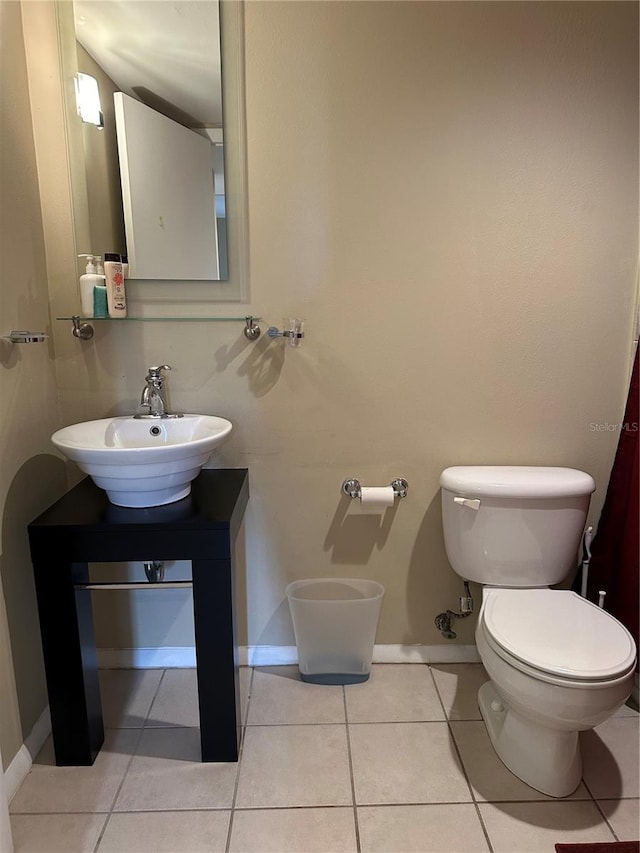 bathroom featuring tile patterned floors, sink, and toilet