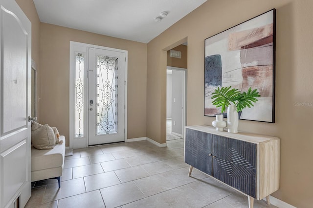 entryway featuring light tile patterned flooring