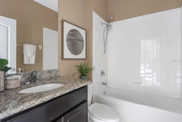 full bathroom featuring toilet, vanity, and tiled shower / bath