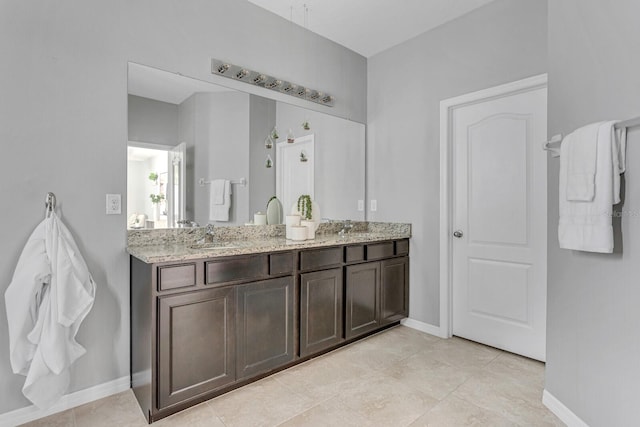 bathroom featuring tile patterned flooring and vanity