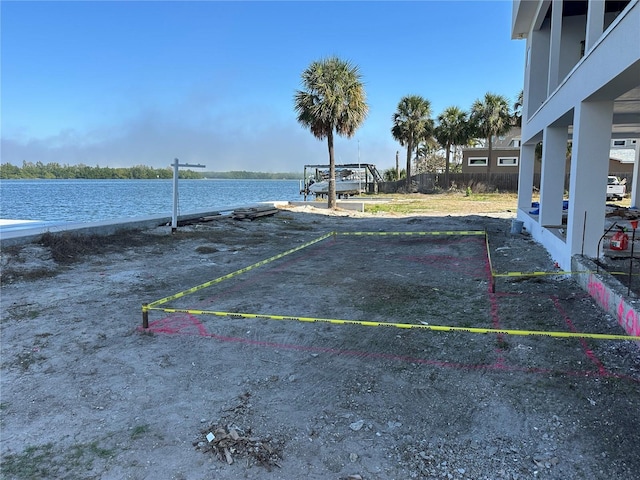 uncovered parking lot with a water view