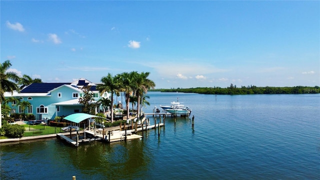 view of dock featuring a water view and boat lift