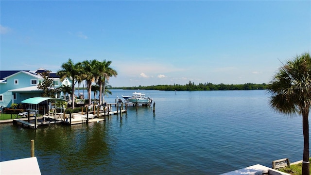 view of dock featuring a water view and boat lift