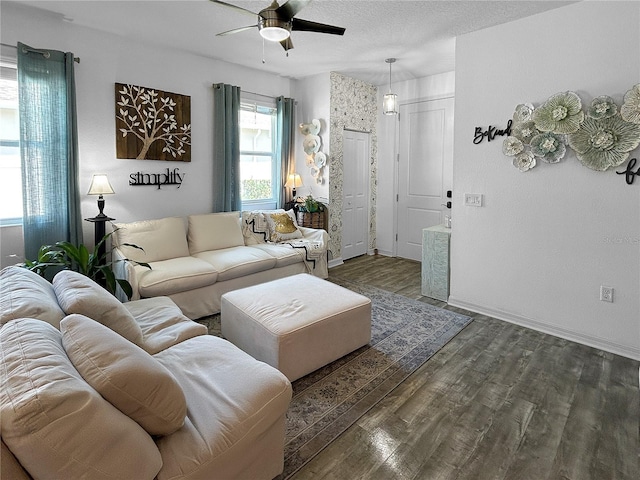 living room with ceiling fan and hardwood / wood-style flooring