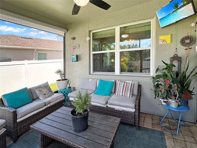 exterior space with ceiling fan