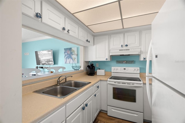 kitchen featuring white cabinetry, sink, and white appliances