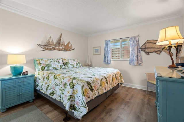 bedroom with crown molding, a textured ceiling, and dark hardwood / wood-style flooring