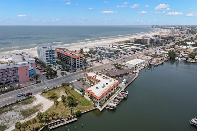 bird's eye view featuring a view of the beach and a water view