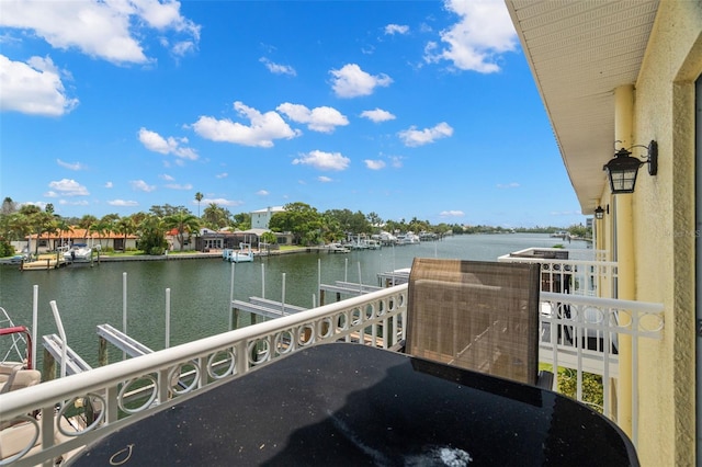 balcony featuring a water view