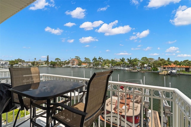 balcony featuring a water view