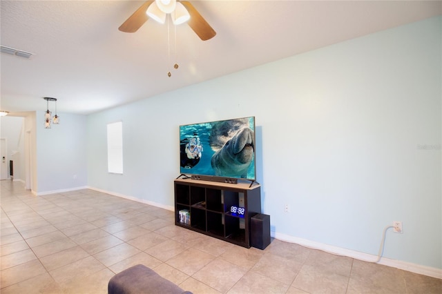 living room with ceiling fan with notable chandelier and light tile patterned flooring