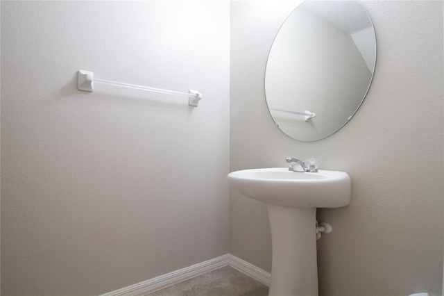 bathroom with tile patterned floors