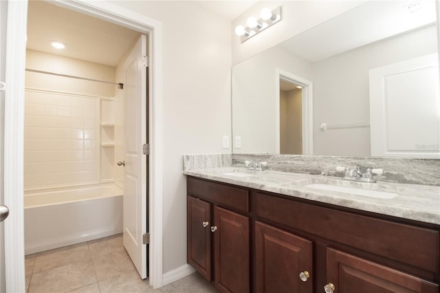 bathroom with vanity, tile patterned floors, and shower / washtub combination