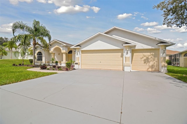 ranch-style home featuring a garage and a front lawn