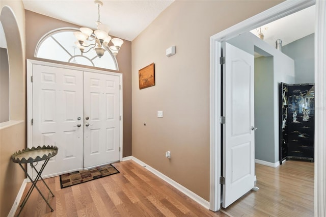 entrance foyer featuring a chandelier and light wood-type flooring