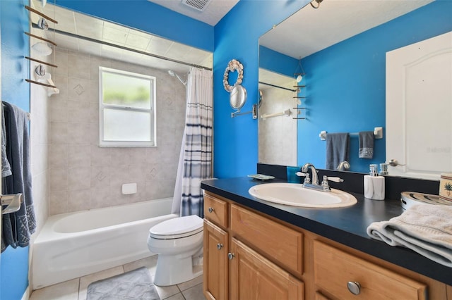 full bathroom with tile patterned flooring, vanity, shower / tub combo with curtain, and toilet