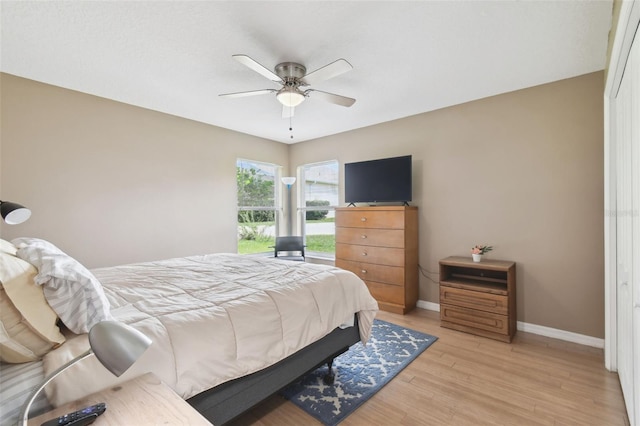 bedroom with ceiling fan and light wood-type flooring