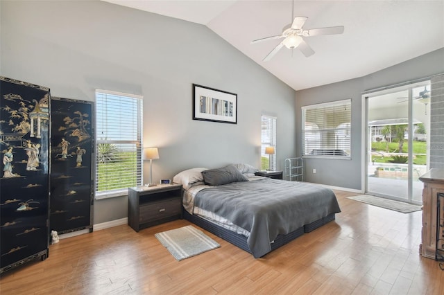 bedroom with hardwood / wood-style flooring, ceiling fan, high vaulted ceiling, and access to outside