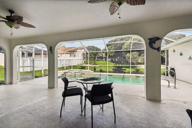 sunroom with plenty of natural light and ceiling fan