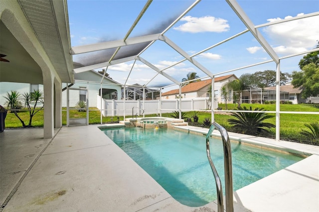 view of swimming pool featuring an in ground hot tub, a lawn, glass enclosure, and a patio