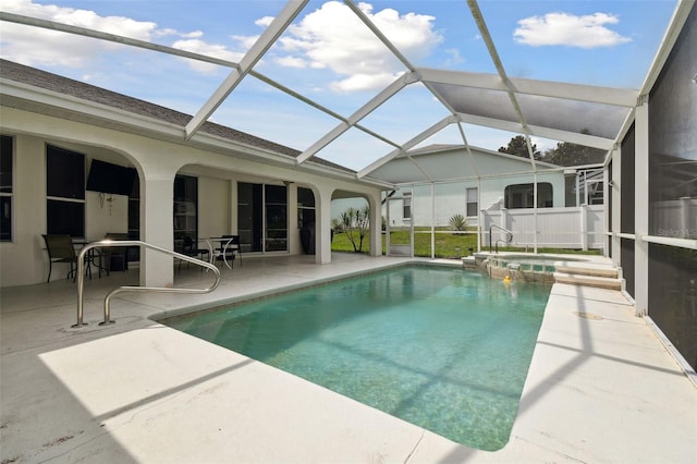 view of swimming pool with an in ground hot tub, a lanai, and a patio area