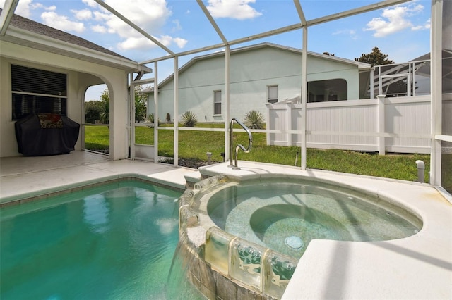 view of pool featuring an in ground hot tub, pool water feature, a lanai, and a lawn