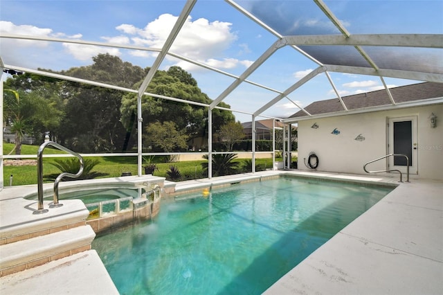 view of pool with an in ground hot tub, a patio, and glass enclosure