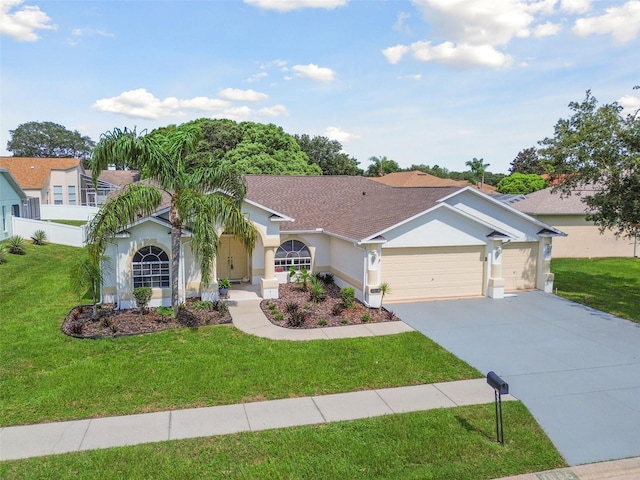 view of front facade featuring a garage and a front lawn