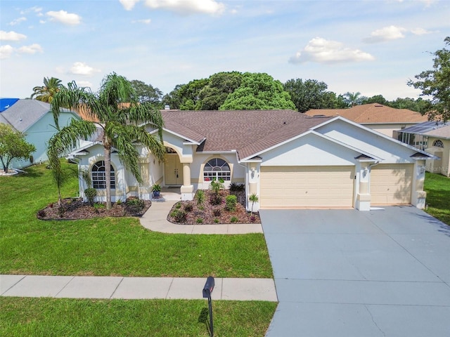 view of front of house with a garage and a front lawn