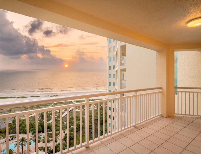 balcony at dusk with a water view