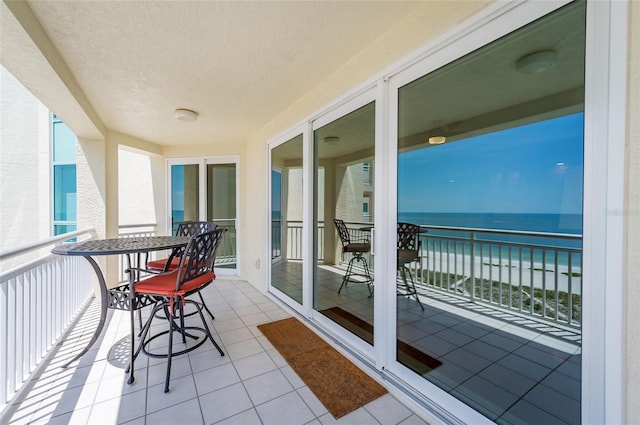 balcony featuring a water view