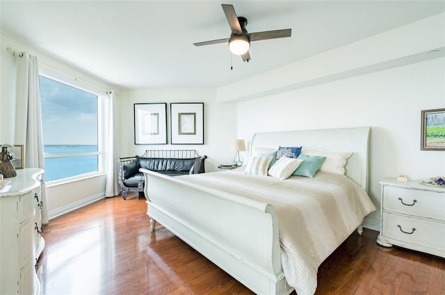 bedroom featuring ceiling fan and wood-type flooring