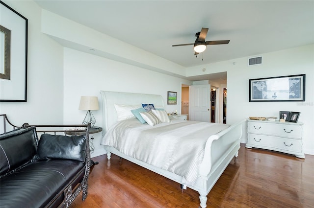 bedroom with ceiling fan and wood-type flooring